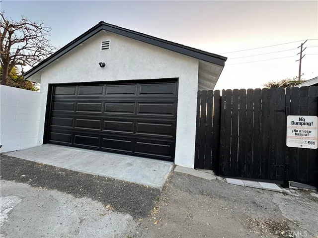 a side view of a house with a garage