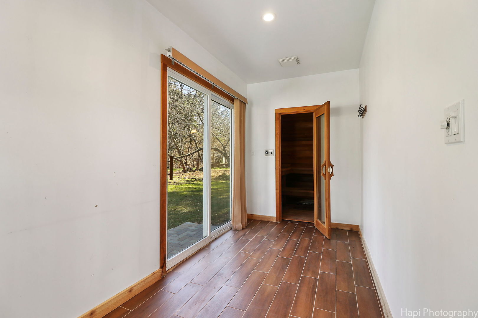 2217 Palatine Road Inverness, IL 60067 - Photo 16 of 28 a view of an empty room with wooden floor and a window