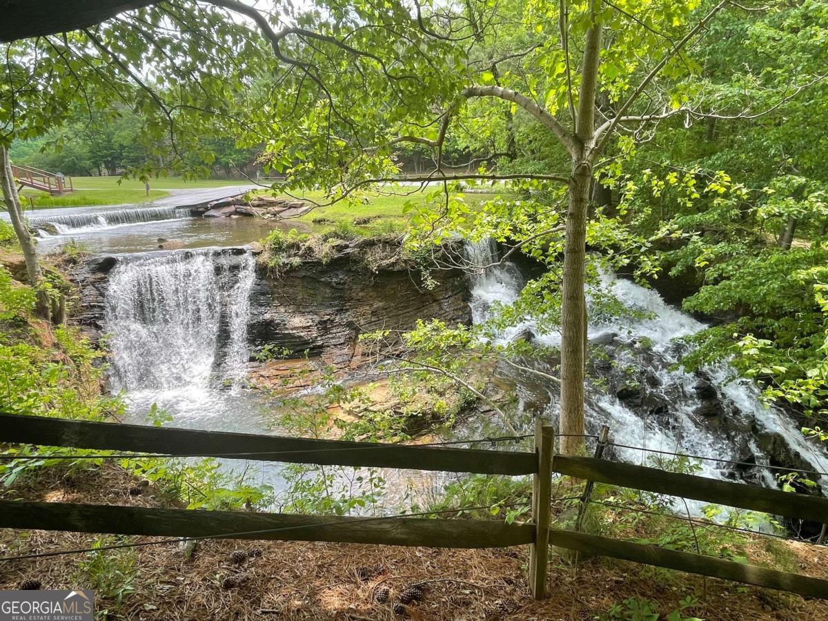 1225-1227 Oglethorpe Road Jasper, GA 30143 - Photo 2 of 40 a view of a lake from a balcony