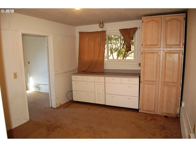 10210 Southwest Grabhorn Road Beaverton, OR 97007 - Photo 7 of 24 a kitchen with a refrigerator and window