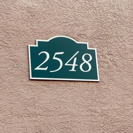 a sign that is on the brick wall