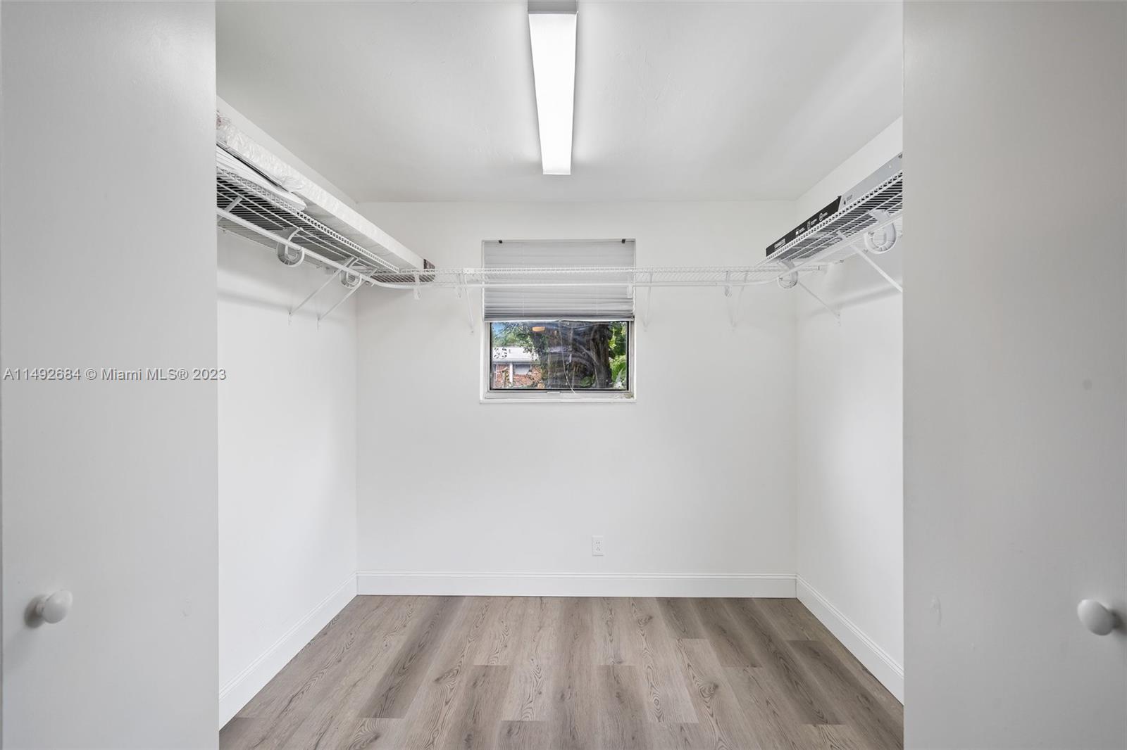 5893 Williamson Road Jupiter, FL 33458 - Photo 11 of 31 a view of a room with wooden floor and window