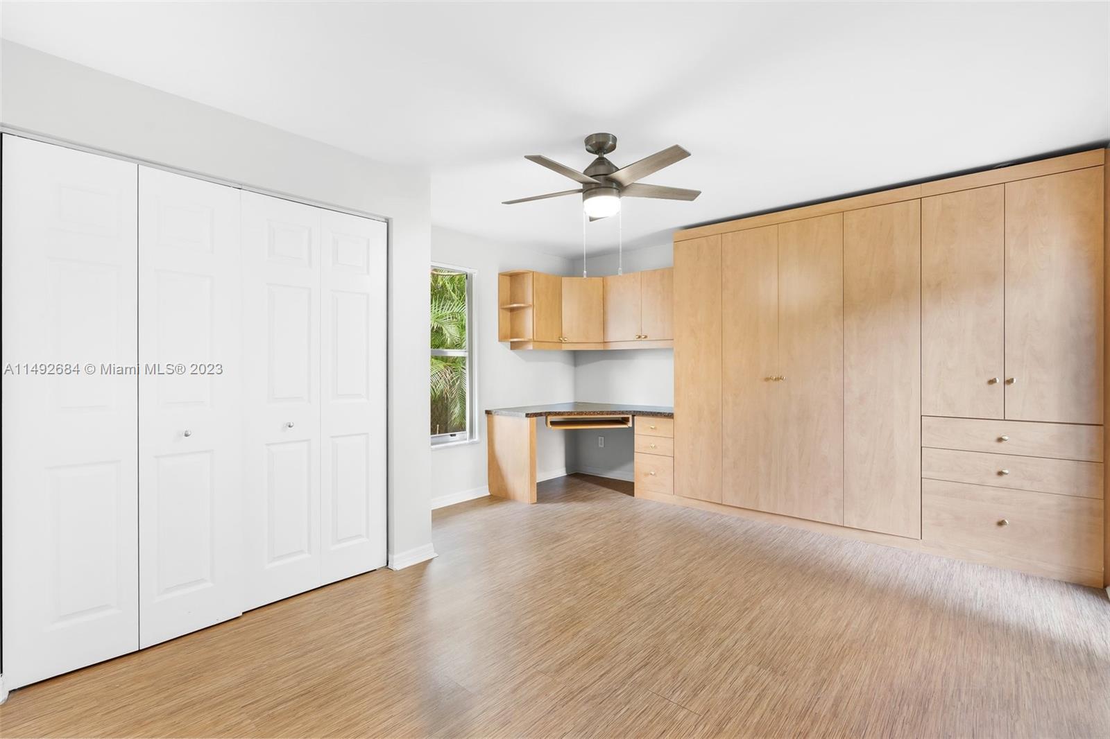 5893 Williamson Road Jupiter, FL 33458 - Photo 16 of 31 a view of a kitchen with a sink and a refrigerator