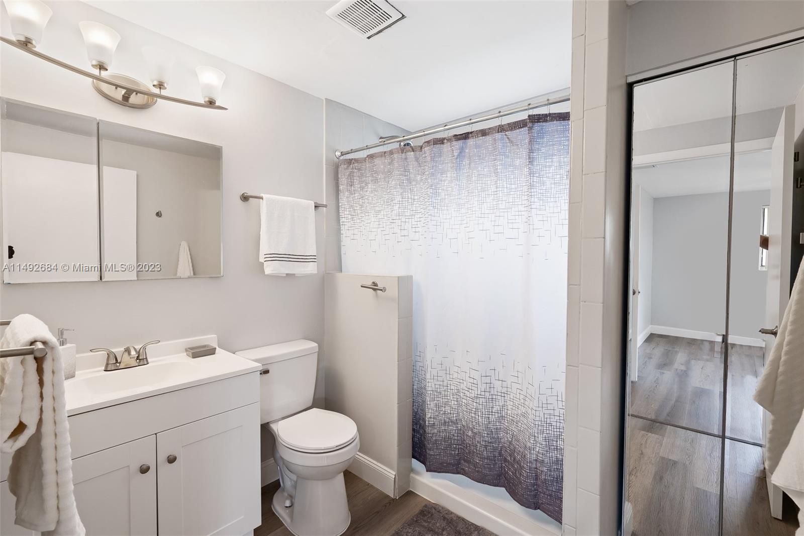 5893 Williamson Road Jupiter, FL 33458 - Photo 8 of 31 a bathroom with a sink toilet and shower