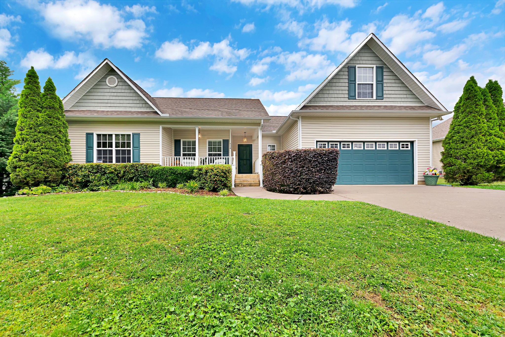 716 Ridgeview Drive Clinton, TN 37716 - Photo 1 of 23 a front view of a house with a yard and garage