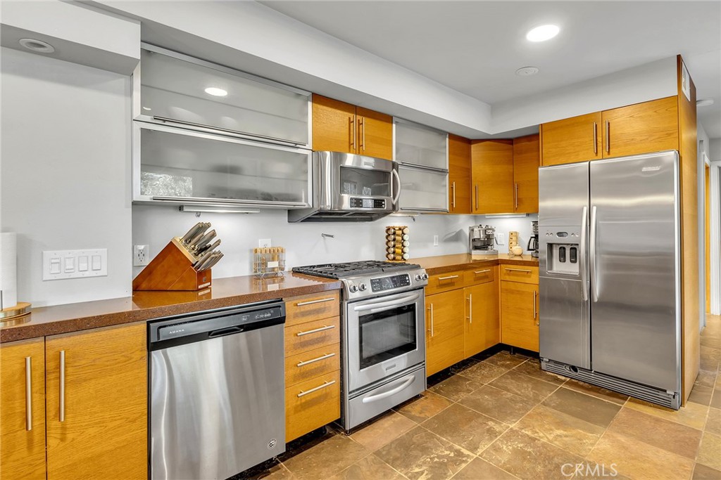 53580 Jeffery Pine Road Idyllwild, CA 92549 - Photo 17 of 61 a kitchen with stainless steel appliances granite countertop a stove a refrigerator and a sink