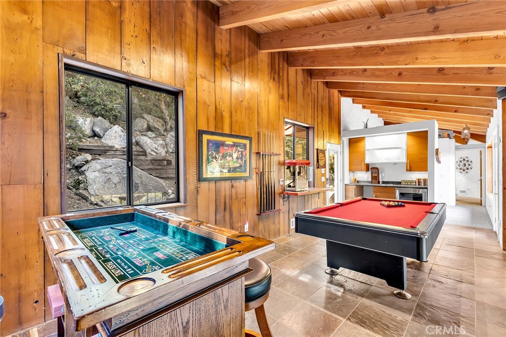 53580 Jeffery Pine Road Idyllwild, CA 92549 - Photo 31 of 61 a living room with pool table and a table