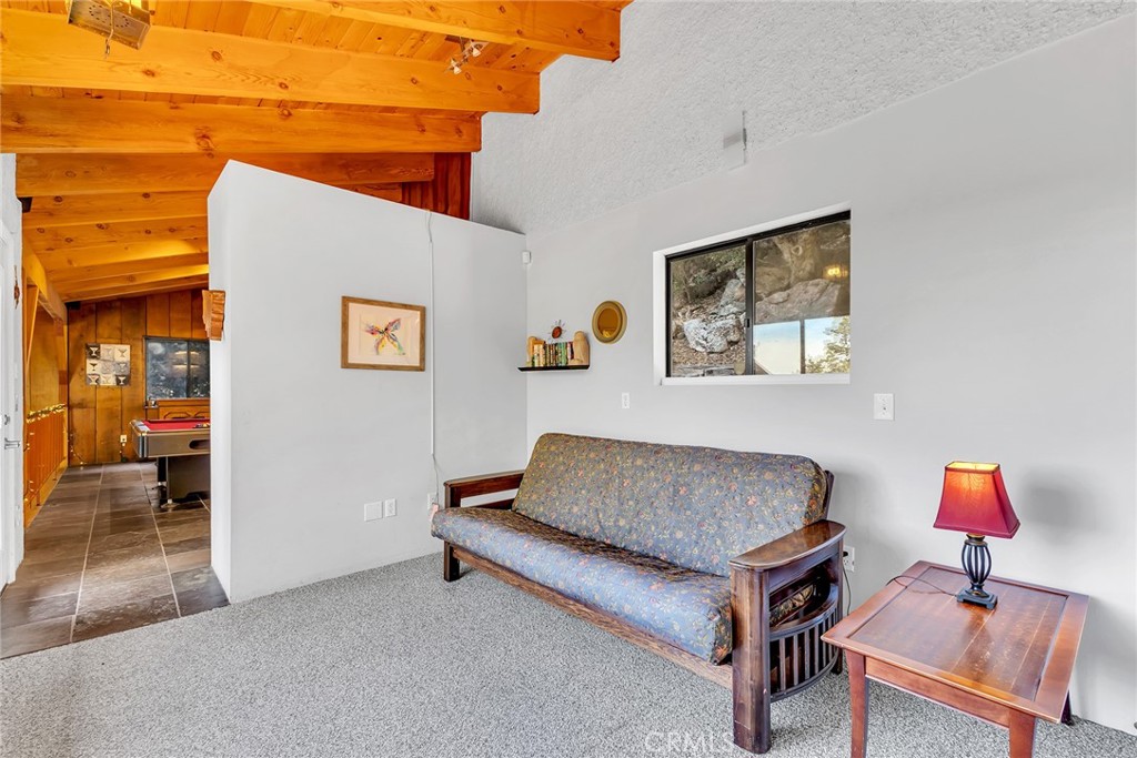 53580 Jeffery Pine Road Idyllwild, CA 92549 - Photo 38 of 61 a living room with furniture and a lamp
