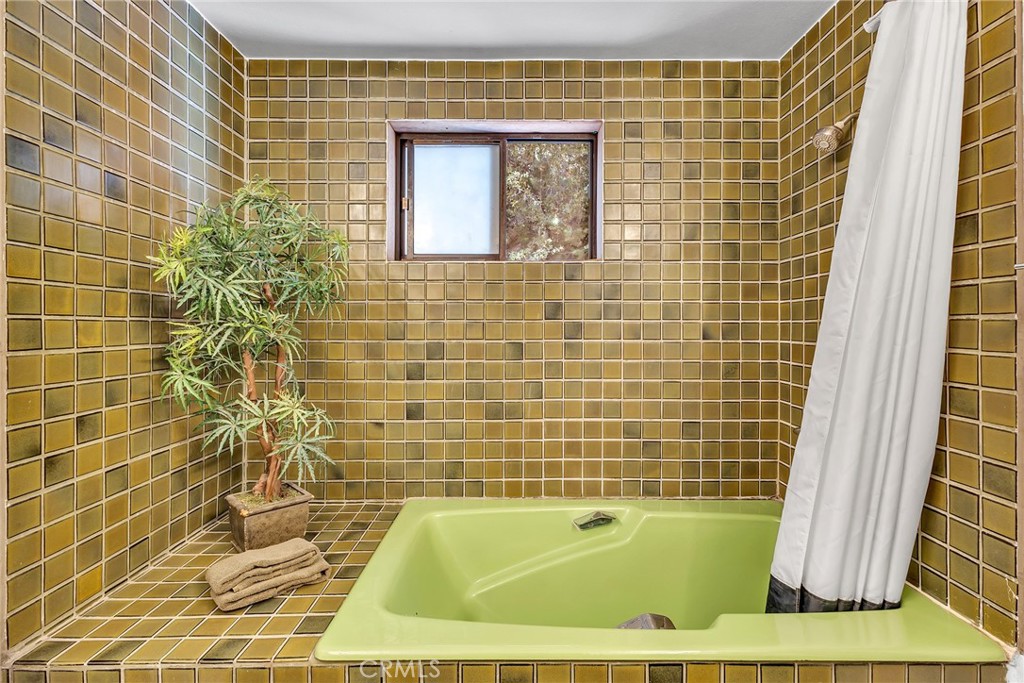 53580 Jeffery Pine Road Idyllwild, CA 92549 - Photo 41 of 61 a bathroom with a bathtub and shower