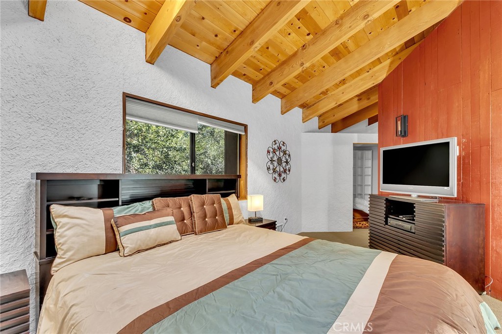 53580 Jeffery Pine Road Idyllwild, CA 92549 - Photo 44 of 61 a bedroom with a bed and a flat screen tv