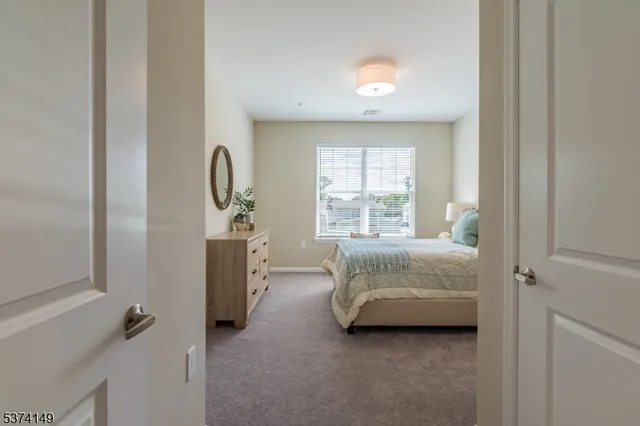 a view of room with a bed and a window