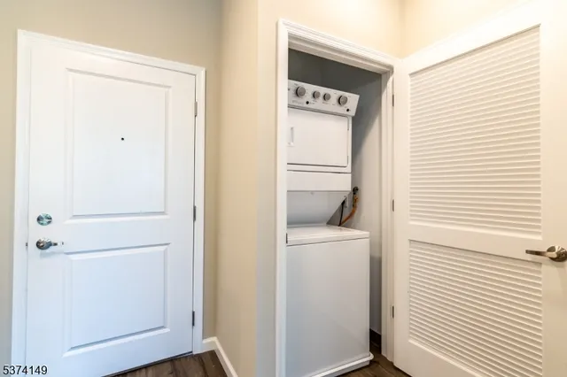a view of washer and dryer with wooden floor