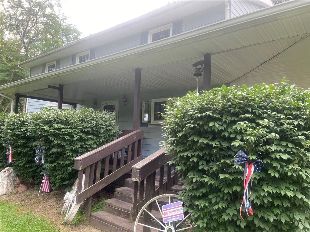 1205 Deer Creek Road West Middlesex, PA 16159 - Photo 1 of 18 a balcony with lots of green space and plants