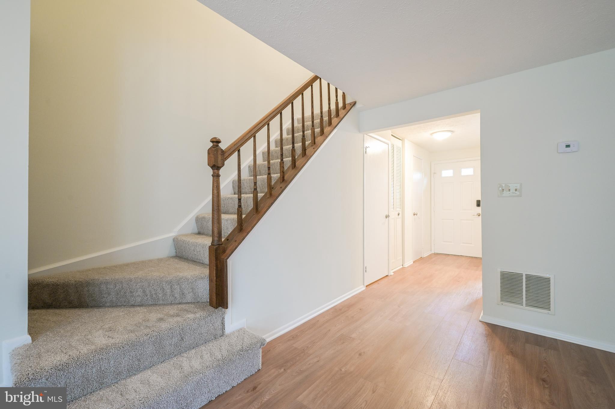 7954 Millstream Court Elkridge, MD 21075 - Photo 21 of 41 a view of entryway and hall with wooden floor