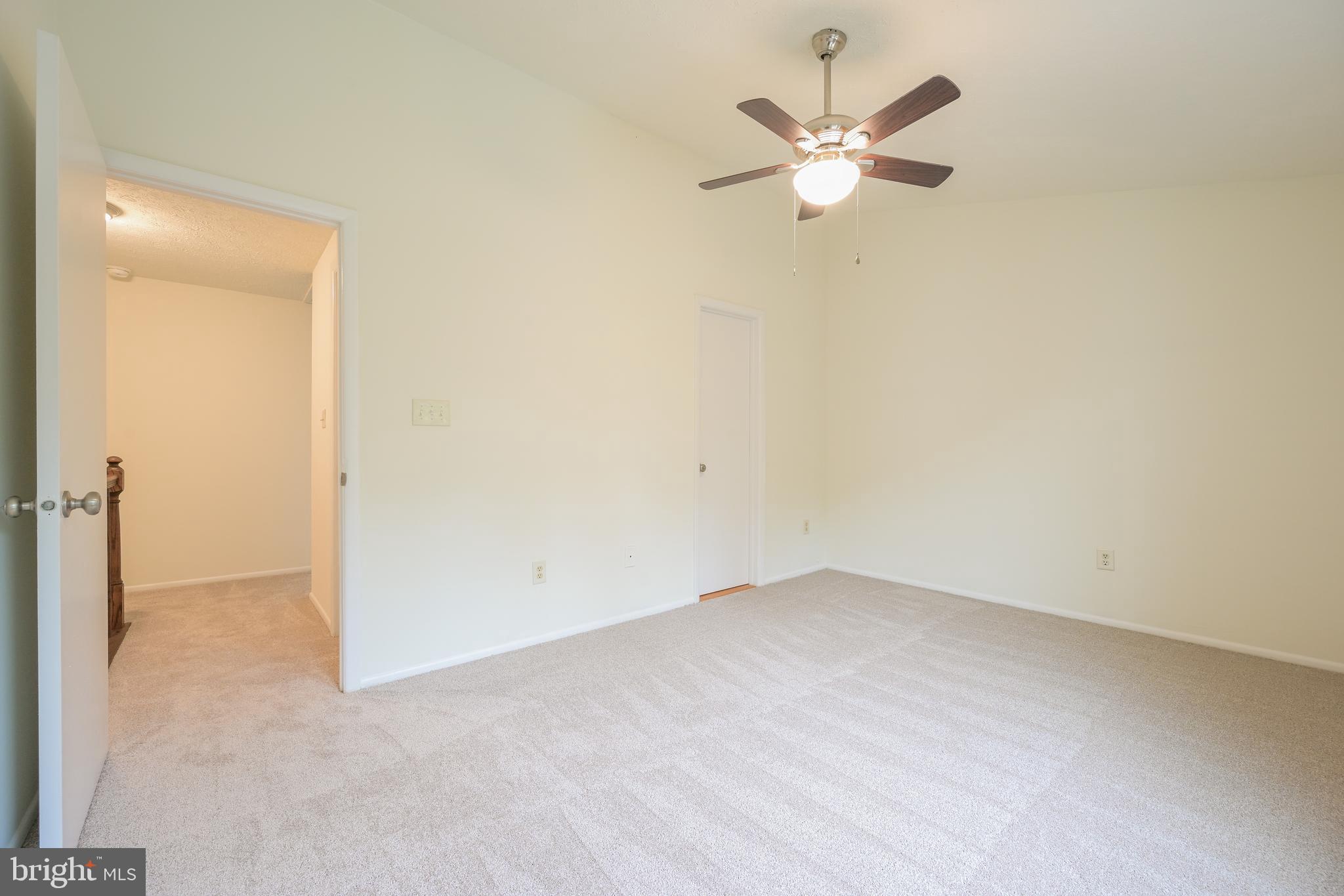 7954 Millstream Court Elkridge, MD 21075 - Photo 29 of 41 an empty room with ceiling fan and window