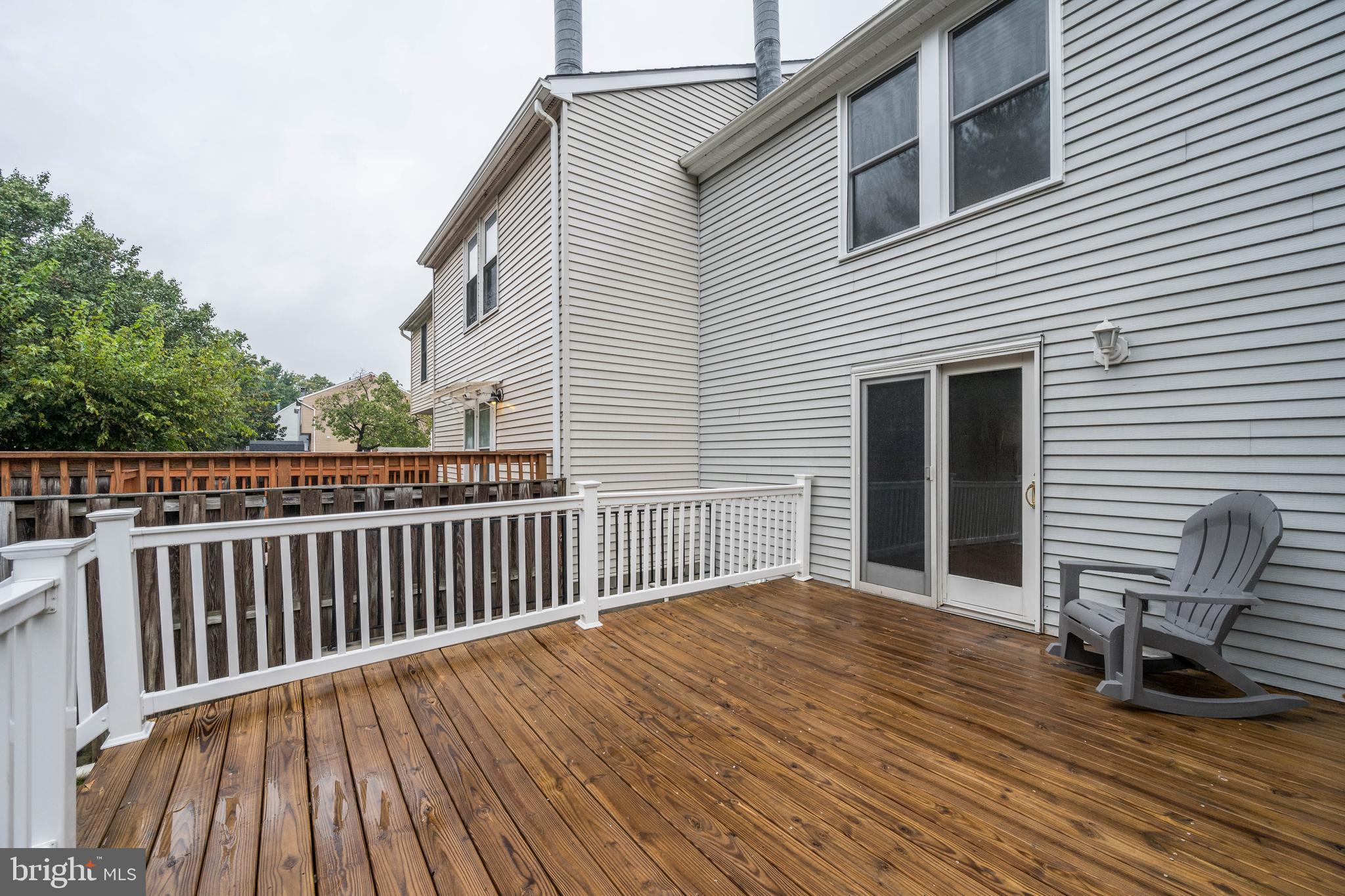 7954 Millstream Court Elkridge, MD 21075 - Photo 38 of 41 a view of a wooden chairs on deck