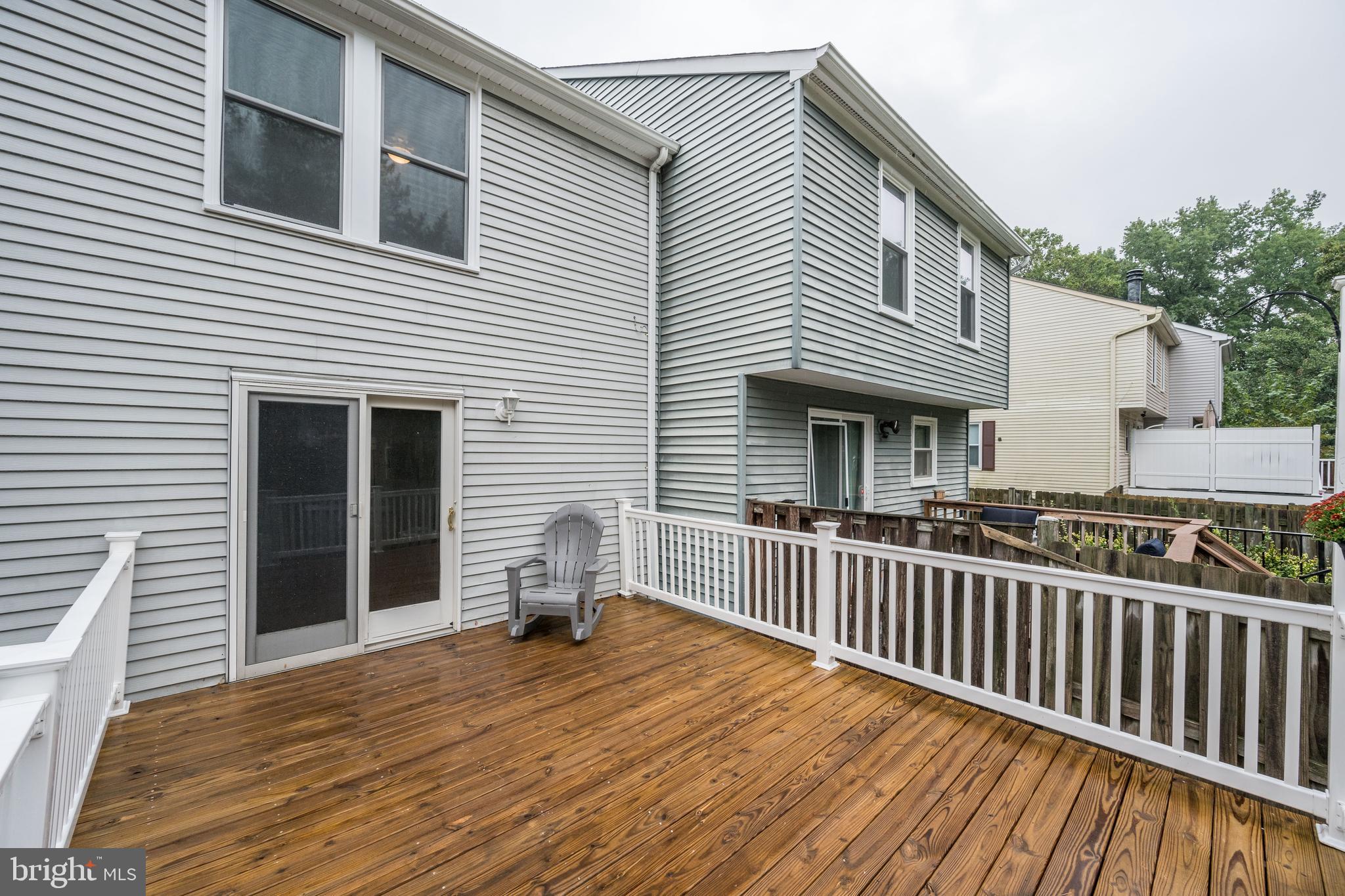 7954 Millstream Court Elkridge, MD 21075 - Photo 39 of 41 a view of a house with wooden deck