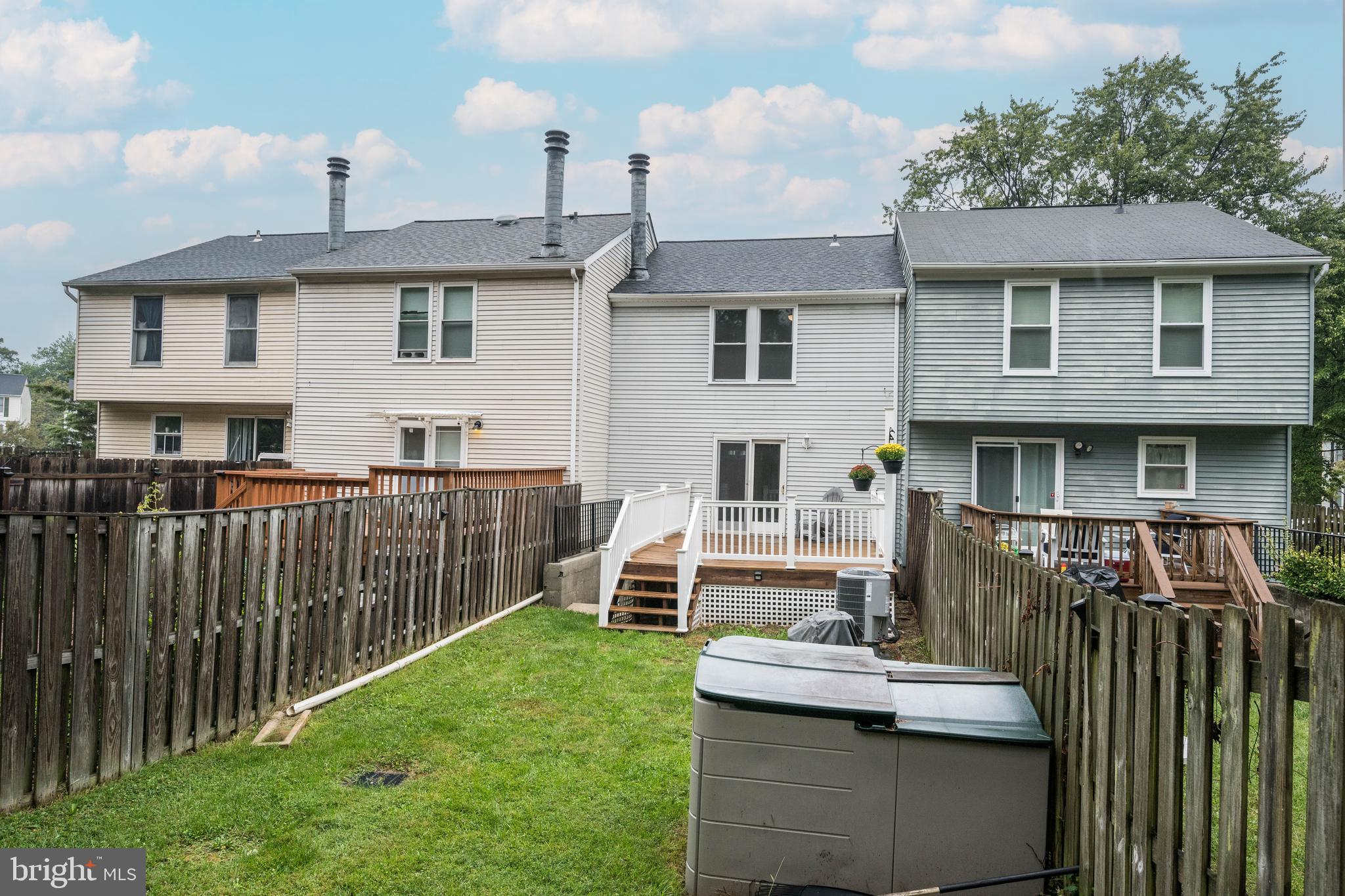 7954 Millstream Court Elkridge, MD 21075 - Photo 7 of 41 a view of a house with wooden deck and furniture