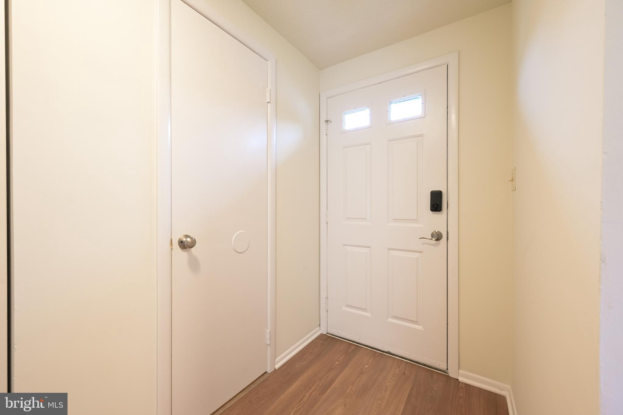 7954 Millstream Court Elkridge, MD 21075 - Photo 8 of 41 a view of an empty room with wooden floor