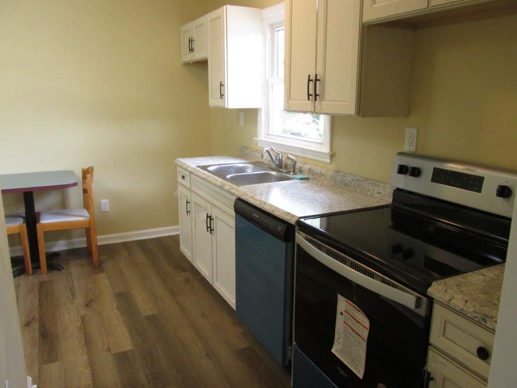3779 Flatwoods Road Elliston, VA 24087 - Photo 2 of 21 a kitchen with a sink stove and cabinets