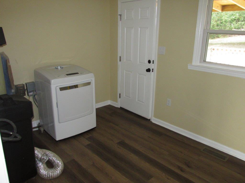 3779 Flatwoods Road Elliston, VA 24087 - Photo 14 of 21 a utility room with wooden floor washer and dryer
