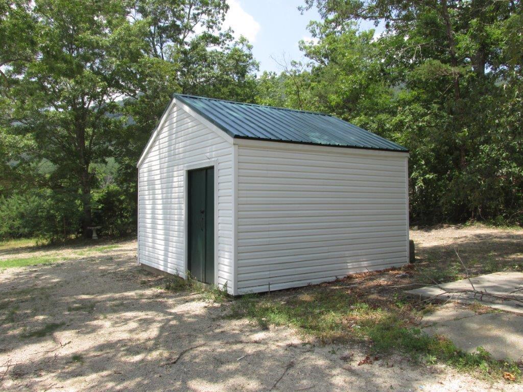 3779 Flatwoods Road Elliston, VA 24087 - Photo 19 of 21 a view of a small house with a barn
