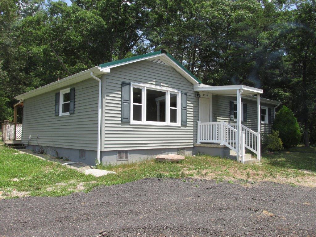 3779 Flatwoods Road Elliston, VA 24087 - Photo 20 of 21 a front view of a house with garden
