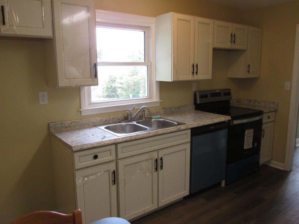 3779 Flatwoods Road Elliston, VA 24087 - Photo 3 of 21 a kitchen with a sink window and cabinets