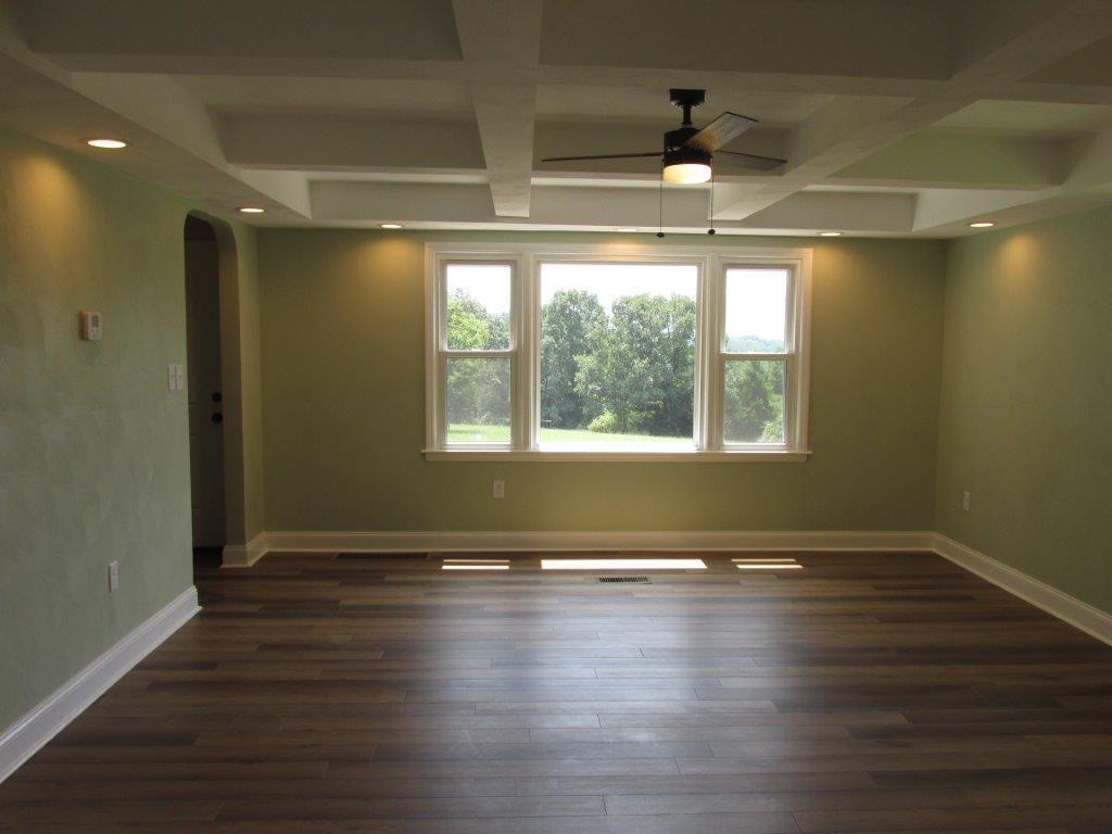 3779 Flatwoods Road Elliston, VA 24087 - Photo 5 of 21 a view of empty room with wooden floor and fan