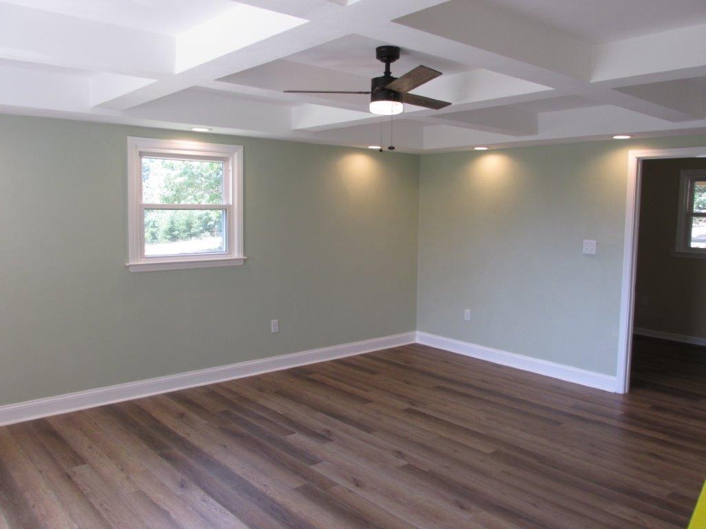 3779 Flatwoods Road Elliston, VA 24087 - Photo 6 of 21 wooden floor in an empty room with a window