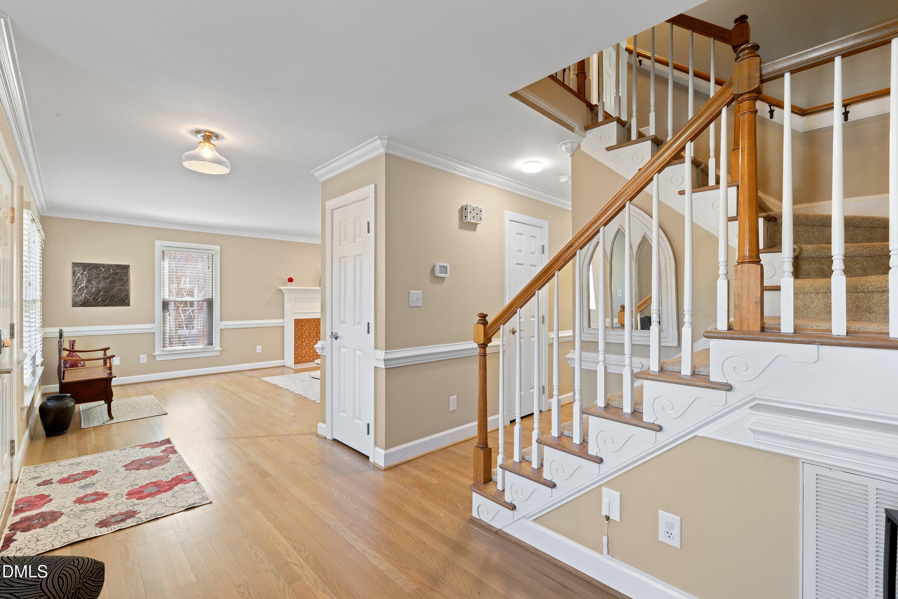 501 Samara Street Apex, NC 27502 - Photo 21 of 77 a view of entryway and hall with wooden floor