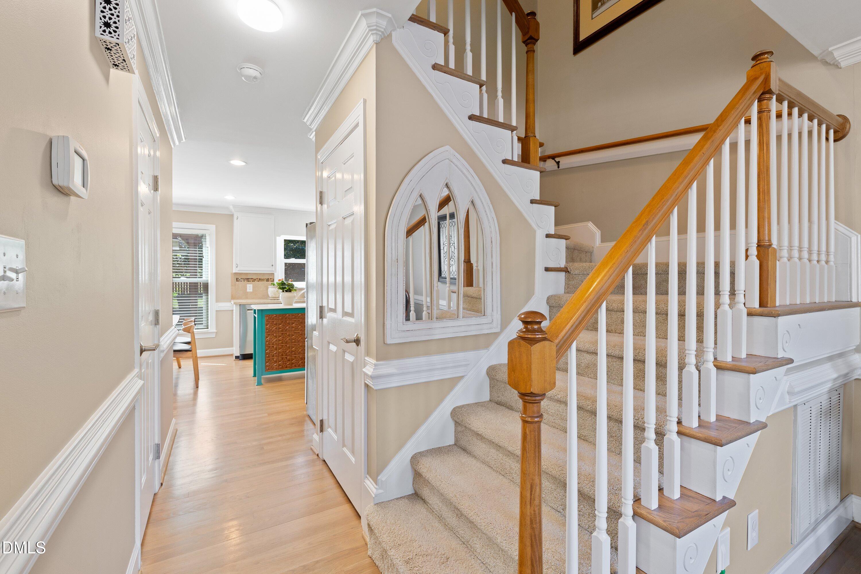 501 Samara Street Apex, NC 27502 - Photo 22 of 77 a view of entryway and hall with wooden floor