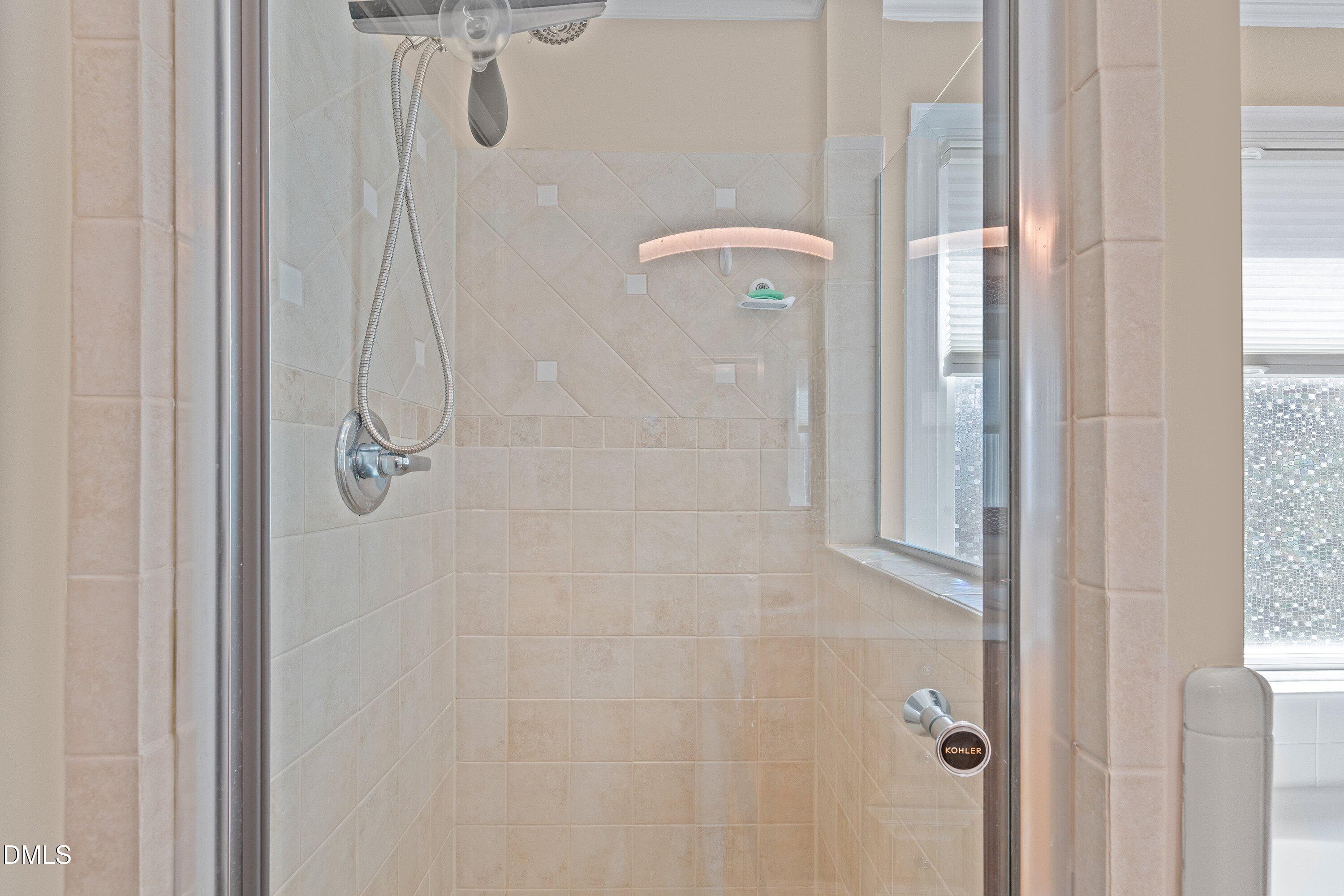 501 Samara Street Apex, NC 27502 - Photo 35 of 77 a bathroom with a shower