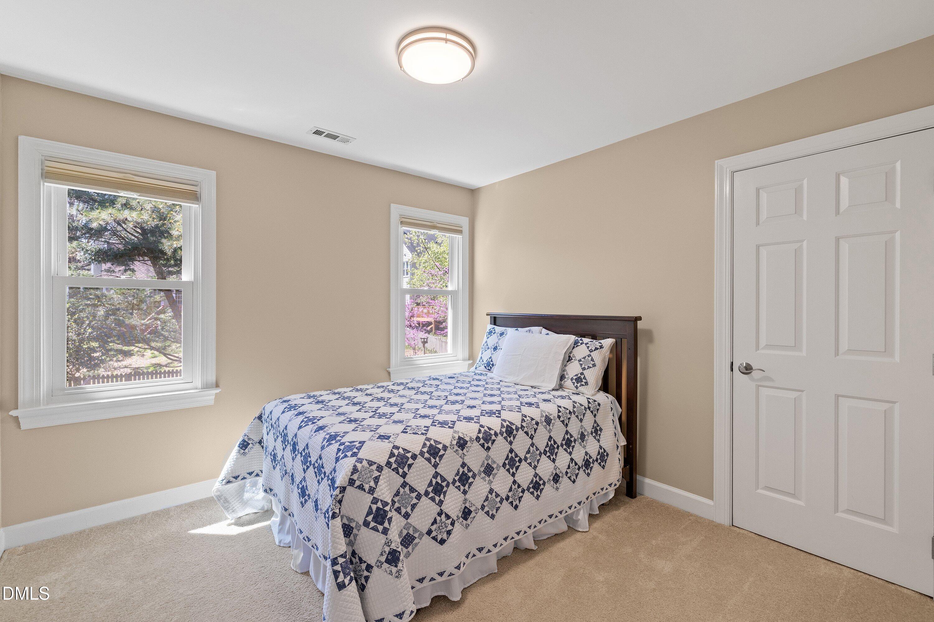 501 Samara Street Apex, NC 27502 - Photo 38 of 77 a bedroom with a bed and a window