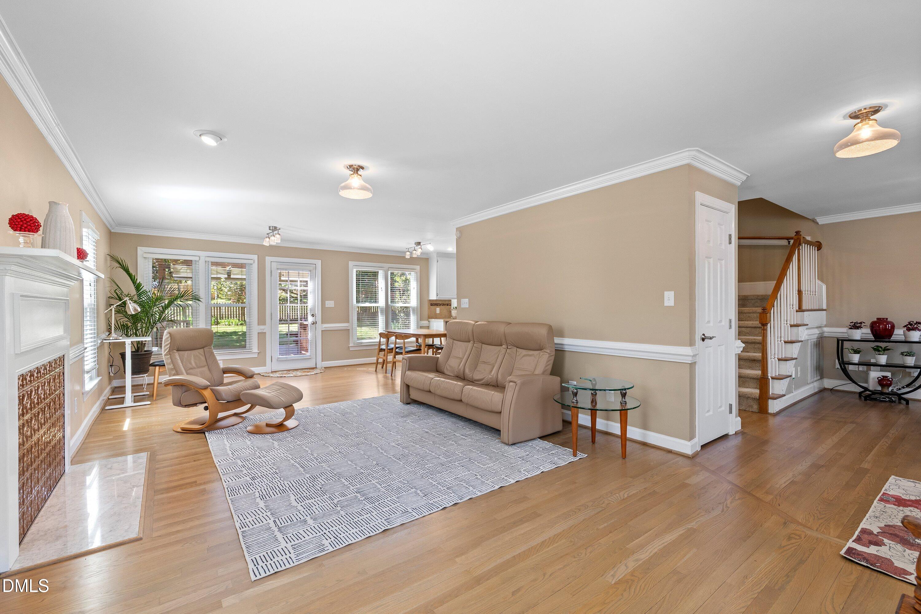 501 Samara Street Apex, NC 27502 - Photo 4 of 77 a living room with furniture and a fireplace