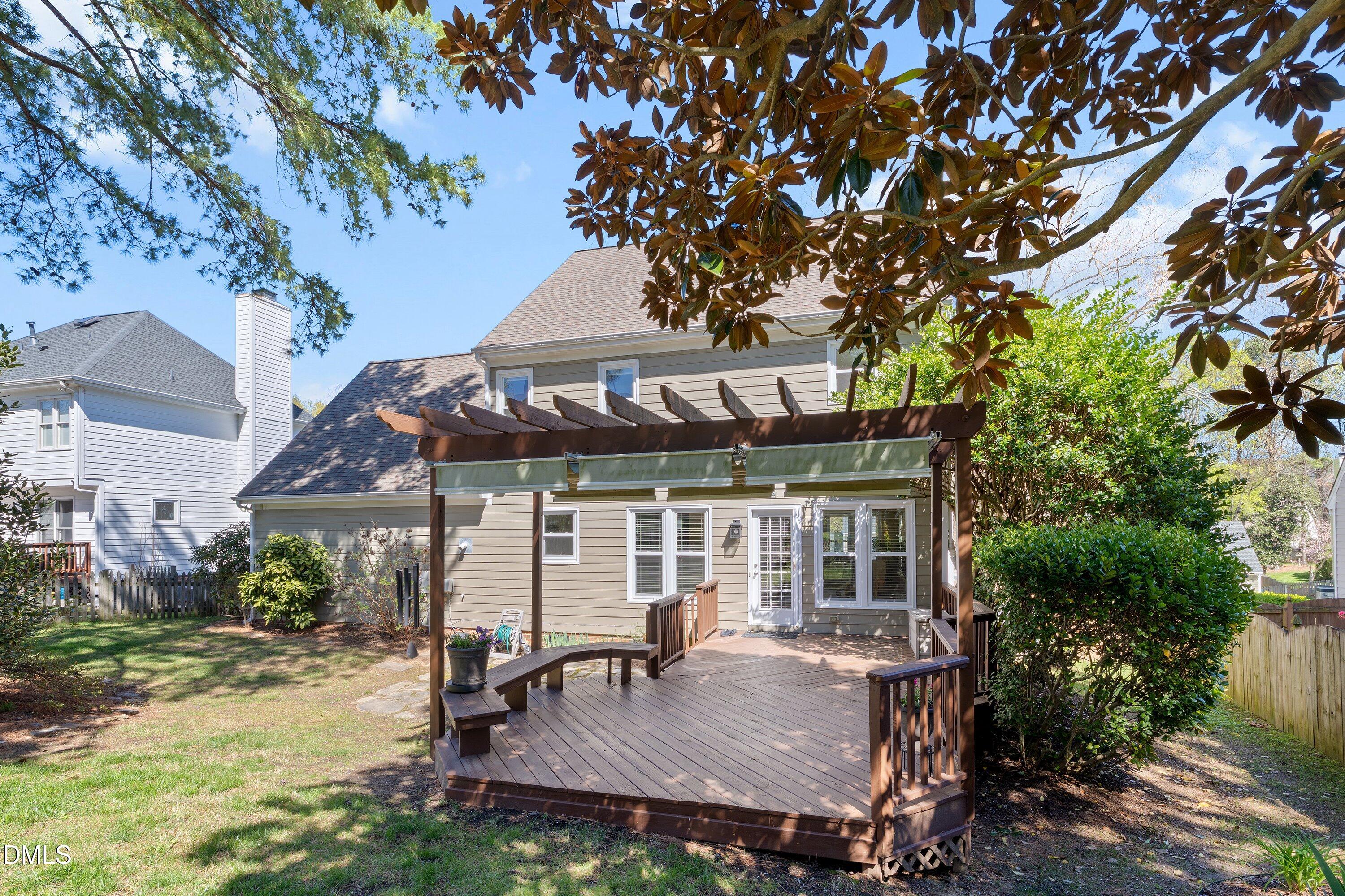 501 Samara Street Apex, NC 27502 - Photo 47 of 77 front view of a house with a chairs and table in the patio