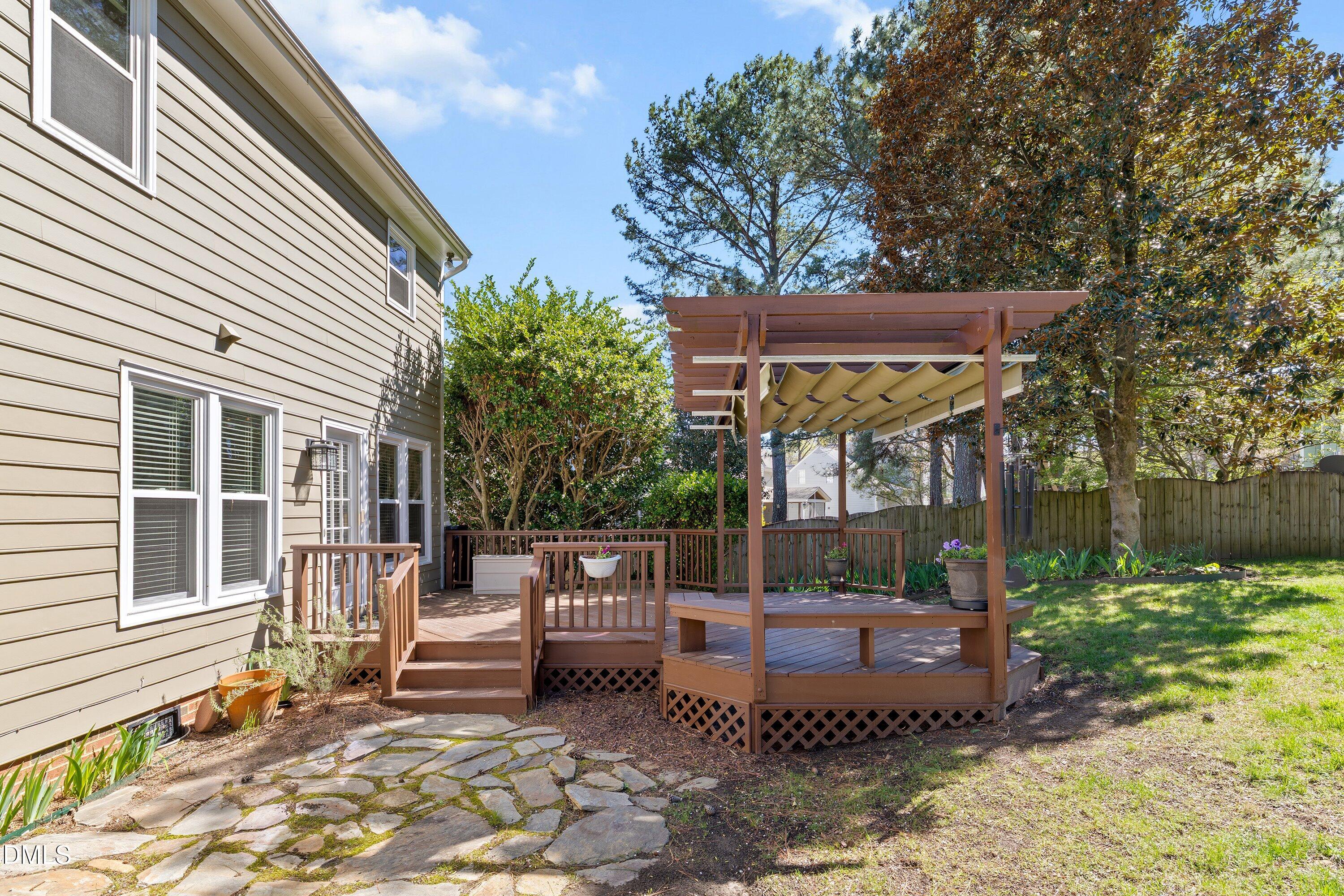 501 Samara Street Apex, NC 27502 - Photo 48 of 77 a view of a chair and table in backyard of the house