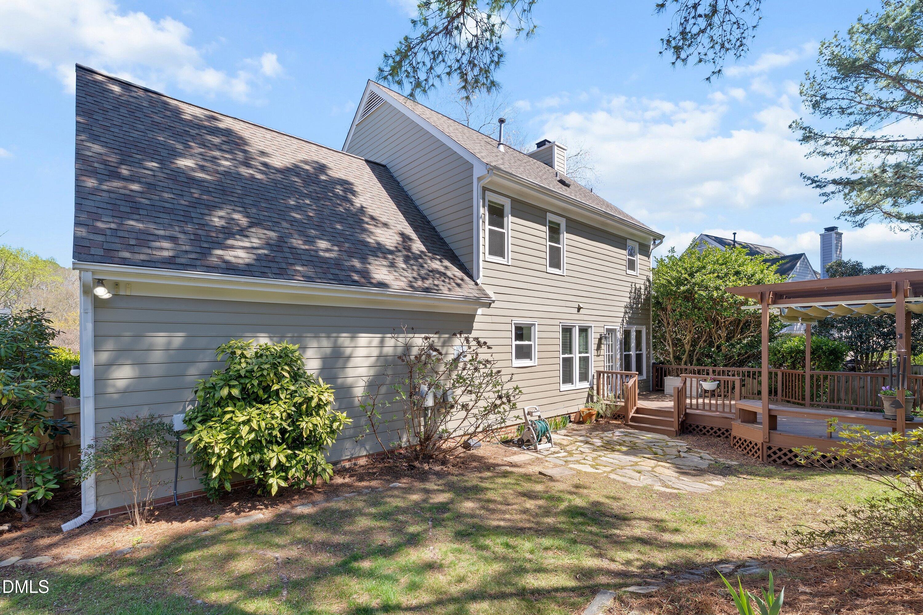 501 Samara Street Apex, NC 27502 - Photo 50 of 77 a view of a house with backyard and sitting area