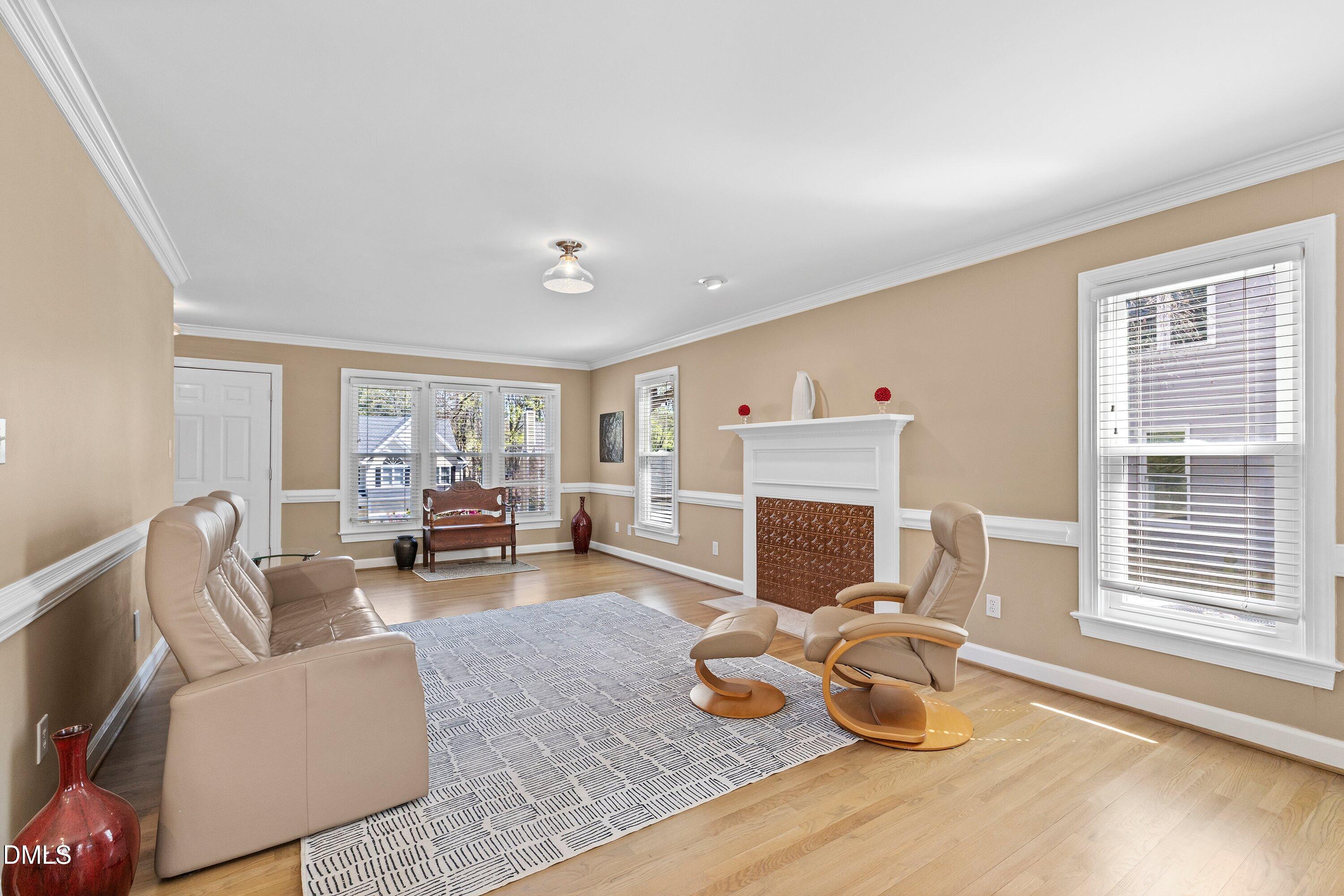 501 Samara Street Apex, NC 27502 - Photo 6 of 77 a living room with furniture and a fireplace