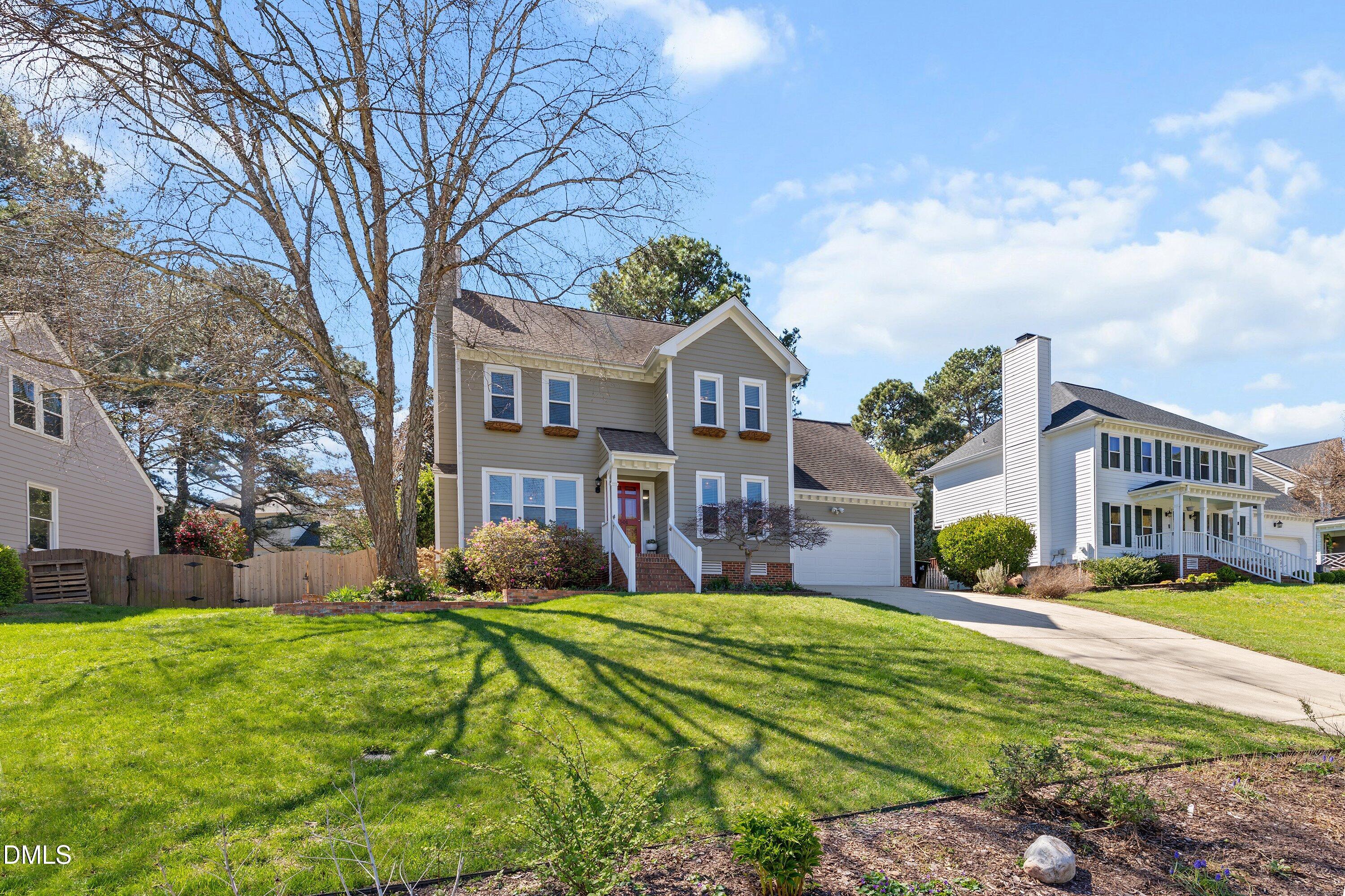 501 Samara Street Apex, NC 27502 - Photo 72 of 77 a front view of a house with a yard and trees