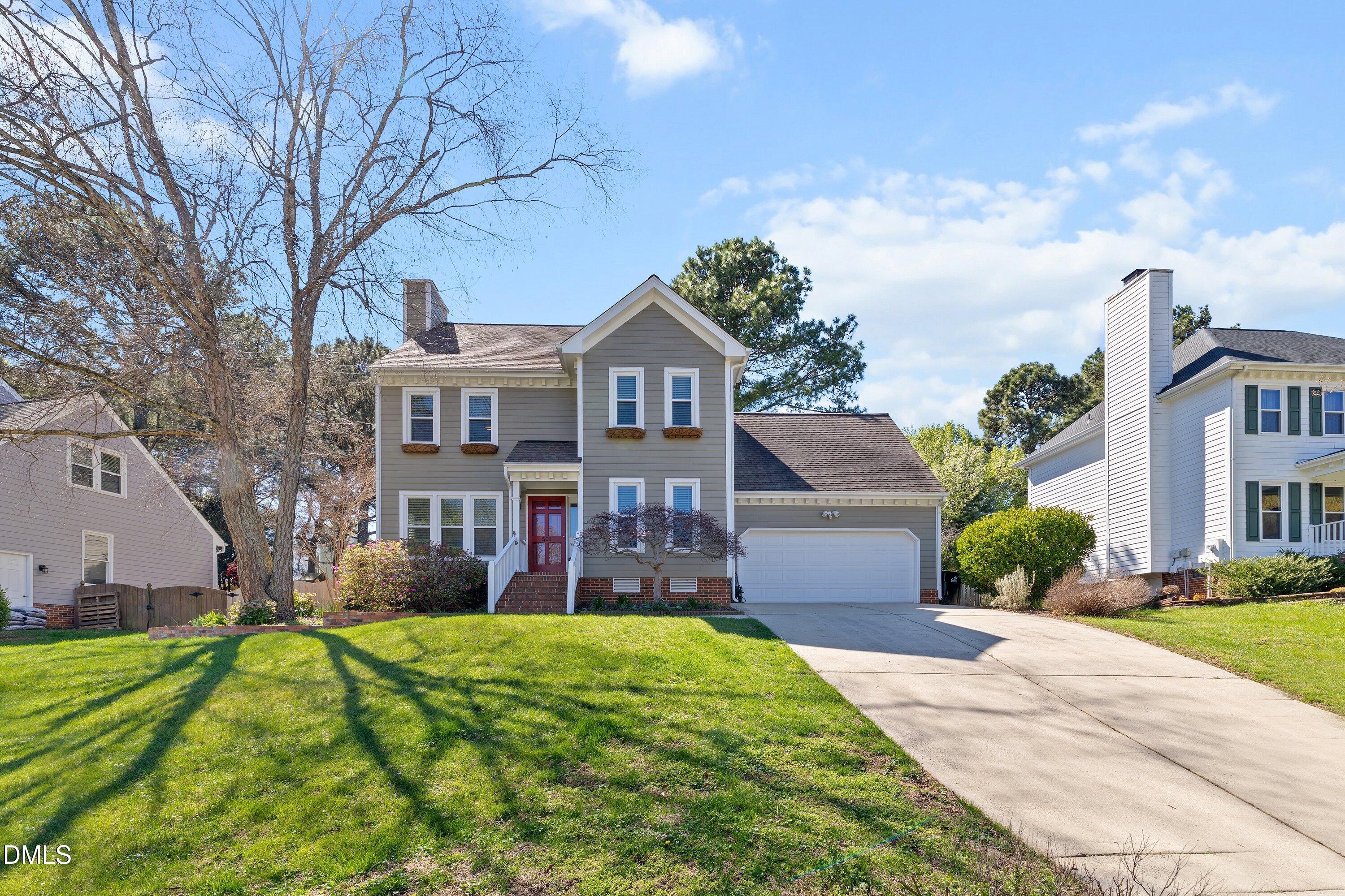 501 Samara Street Apex, NC 27502 - Photo 73 of 77 a front view of a house with a yard and trees