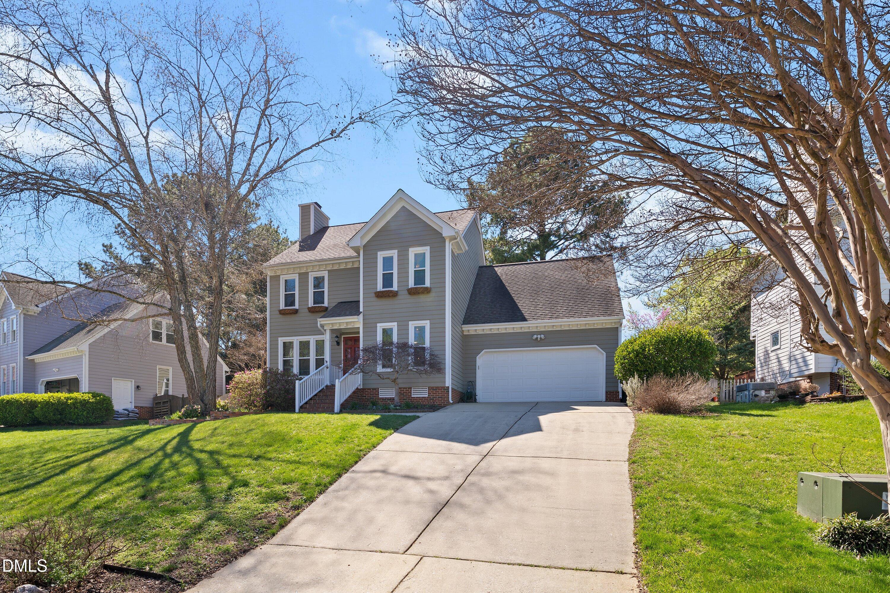 501 Samara Street Apex, NC 27502 - Photo 74 of 77 a front view of a house with garden