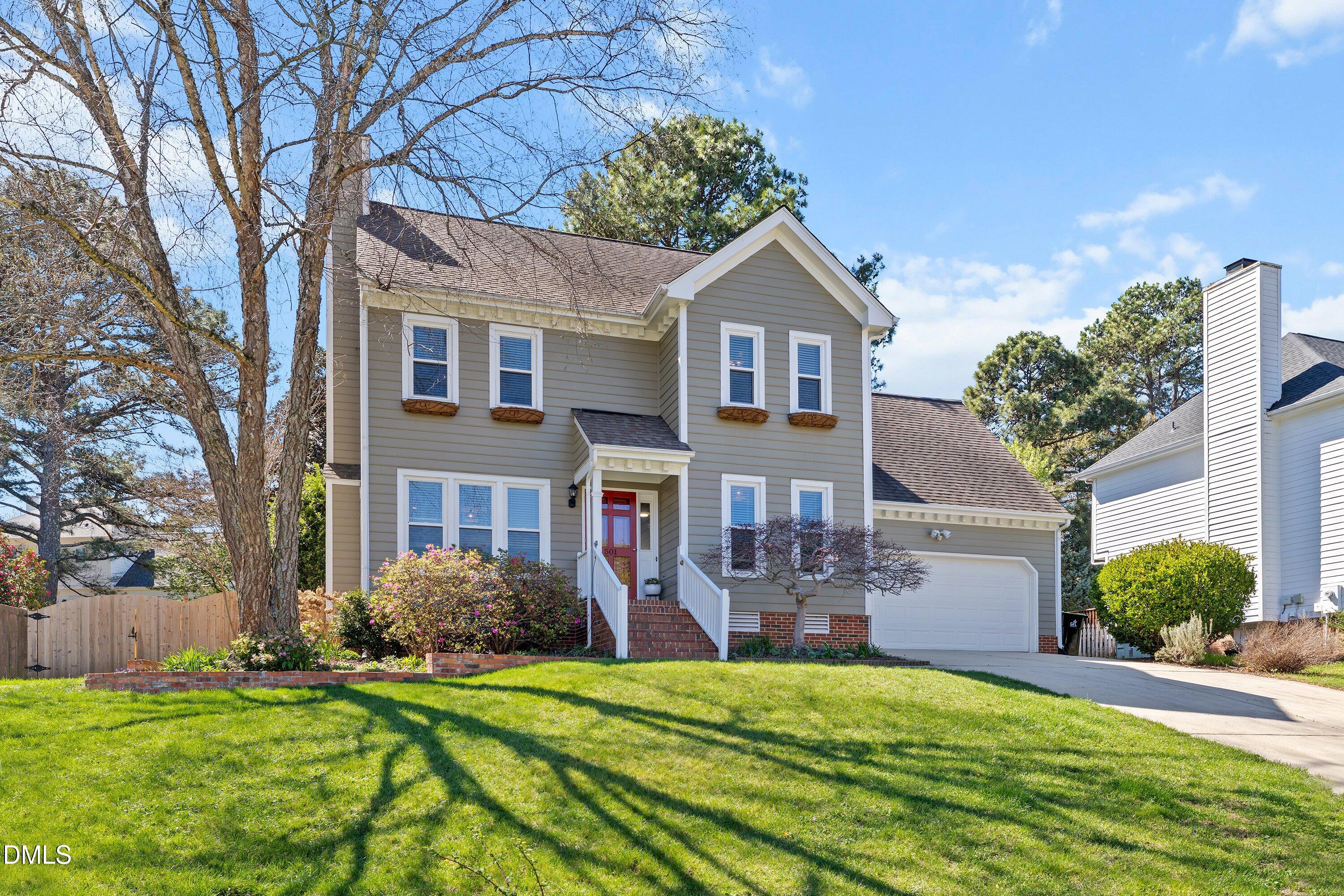 501 Samara Street Apex, NC 27502 - Photo 76 of 77 a front view of a house with a yard