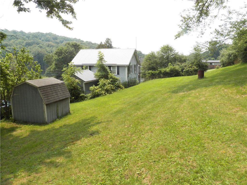 555 MADISON Road Templeton, PA 16259 - Photo 3 of 24 a house view with a garden space