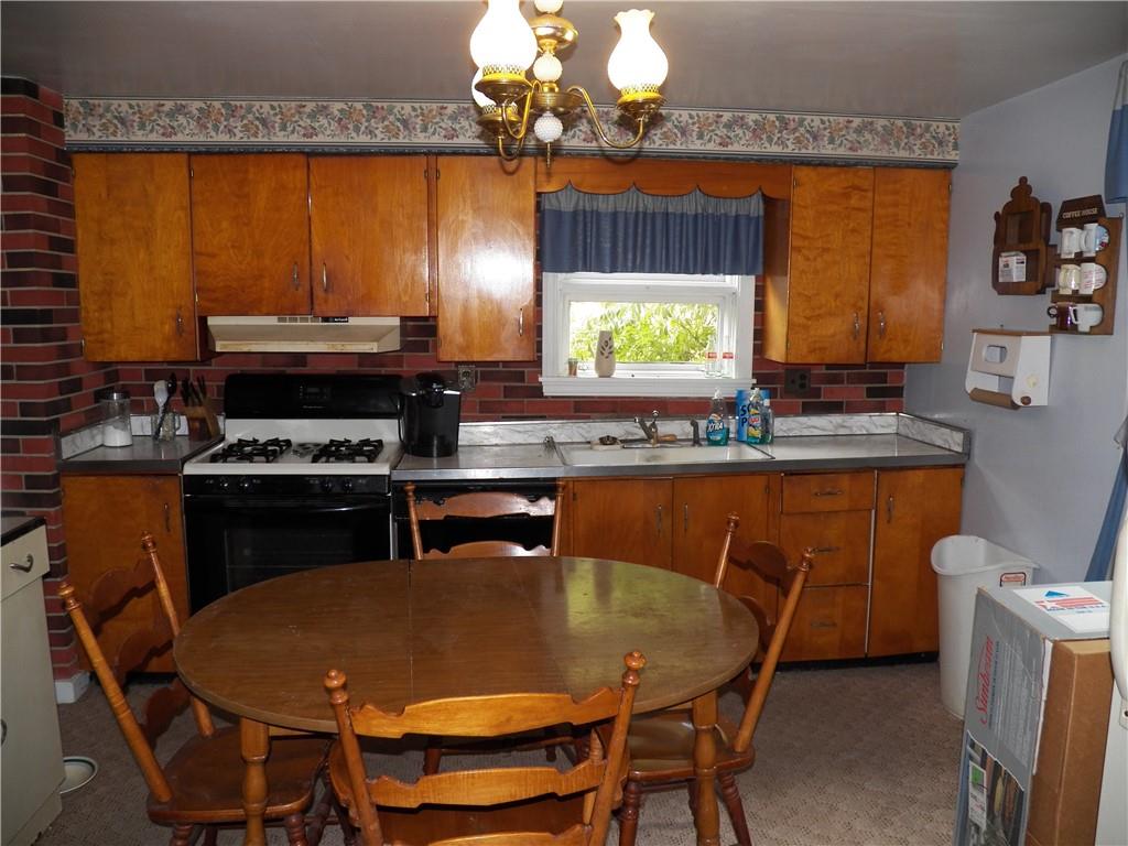 555 MADISON Road Templeton, PA 16259 - Photo 5 of 24 a kitchen with a table chairs and a chandelier