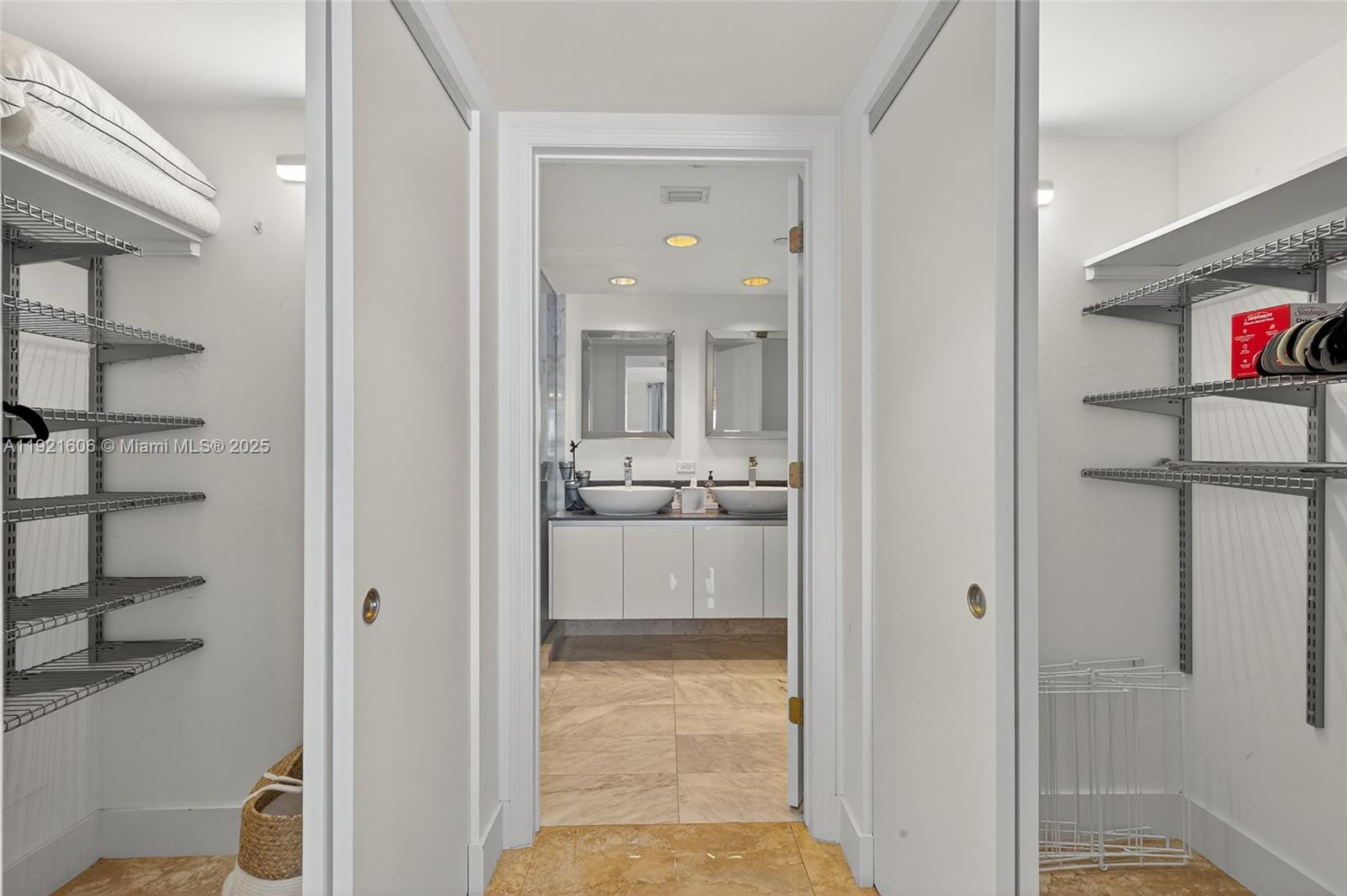 9821 East Bay Harbor Drive, Unit 402 Bay Harbor Islands, FL 33154 - Photo 19 of 34 a view of a hallway with wooden floor and living room