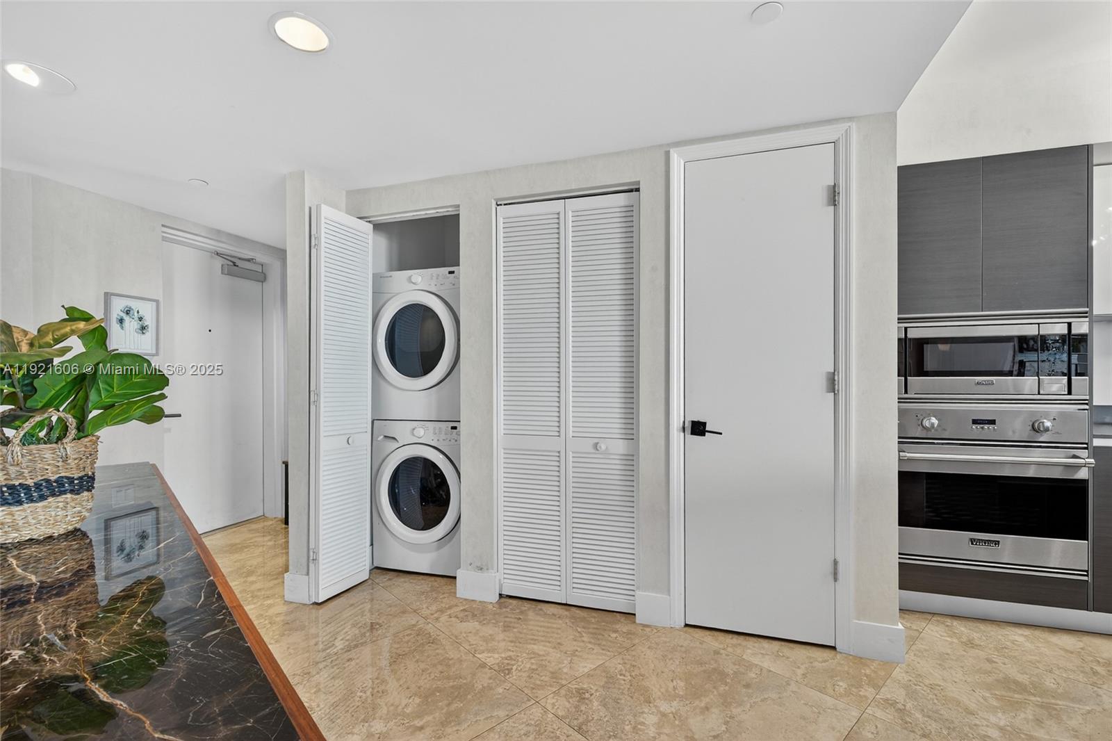 9821 East Bay Harbor Drive, Unit 402 Bay Harbor Islands, FL 33154 - Photo 21 of 34 a view of living room washer and dryer