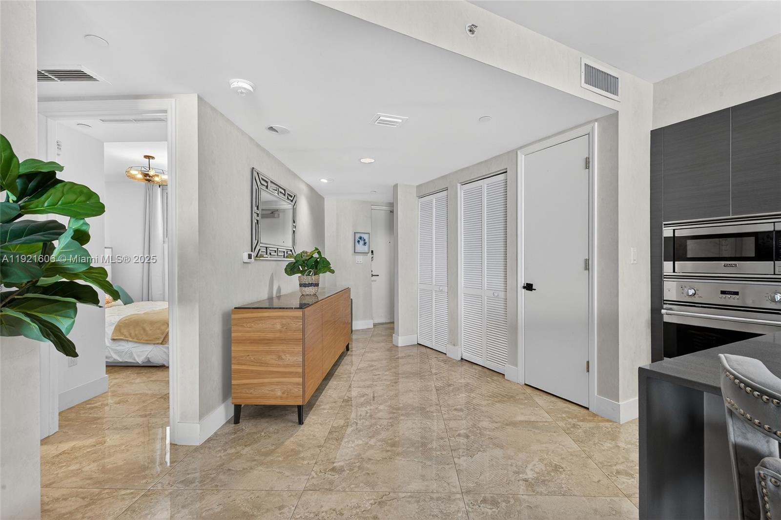 9821 East Bay Harbor Drive, Unit 402 Bay Harbor Islands, FL 33154 - Photo 22 of 34 a room with furniture and a potted plant