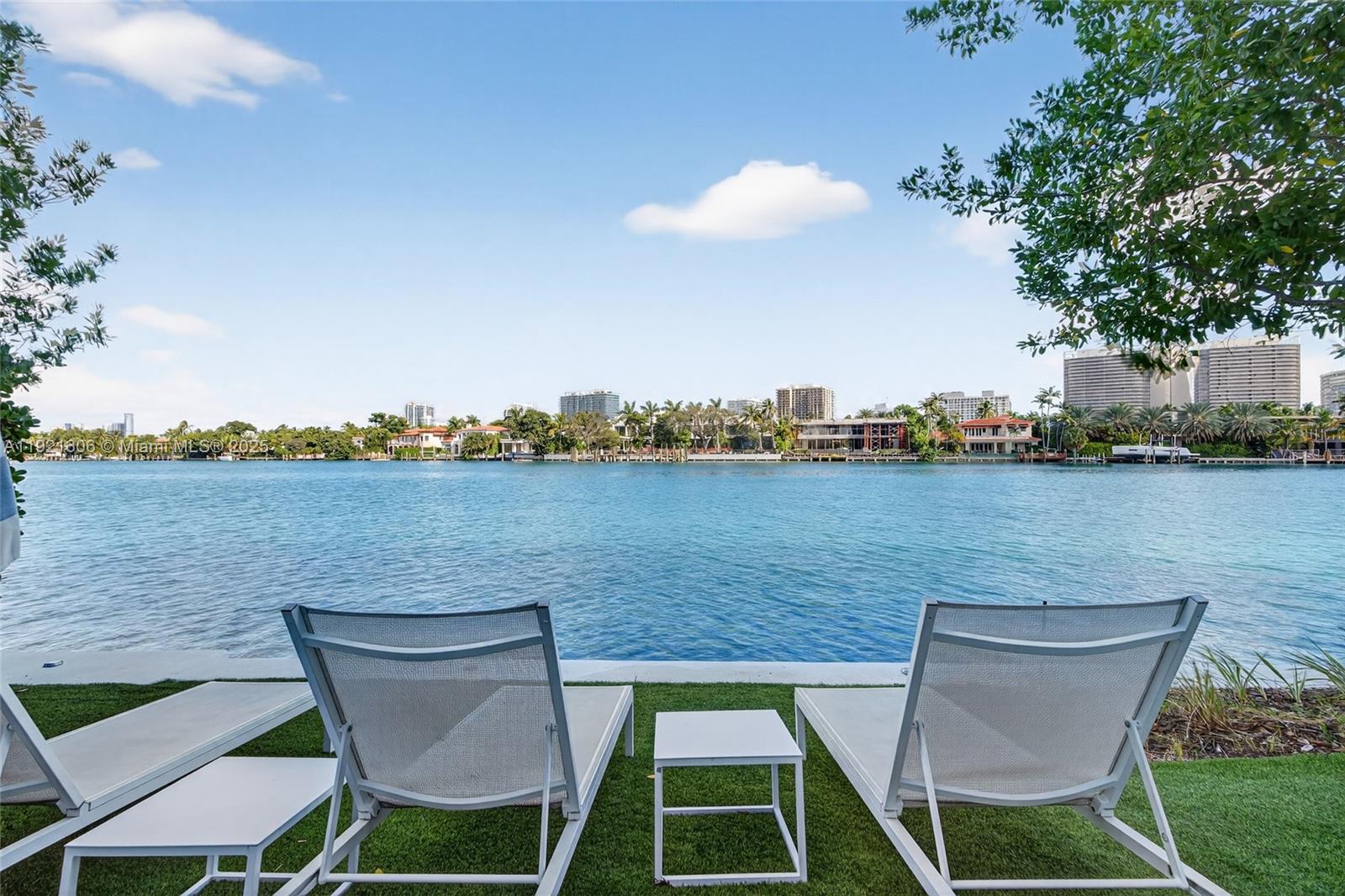 9821 East Bay Harbor Drive, Unit 402 Bay Harbor Islands, FL 33154 - Photo 27 of 34 an aerial view of a house with table and chairs