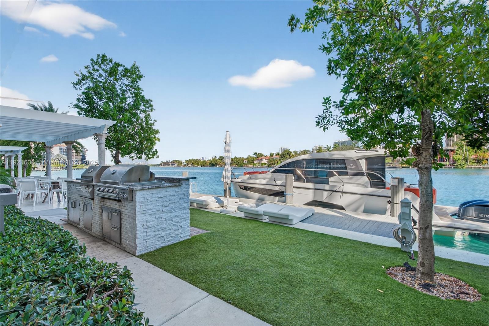 9821 East Bay Harbor Drive, Unit 402 Bay Harbor Islands, FL 33154 - Photo 28 of 34 a view of a house with backyard porch and sitting area